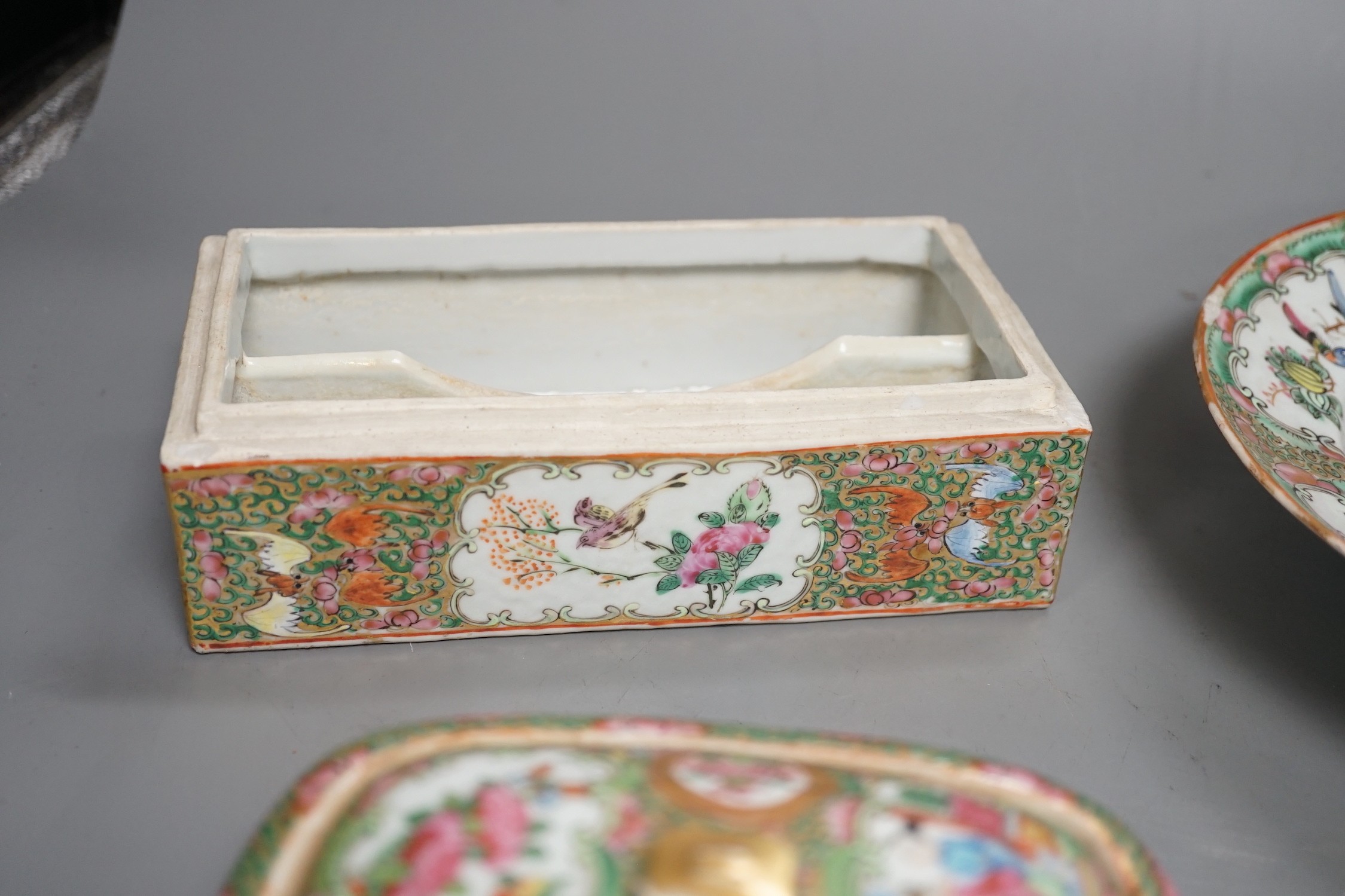 A group of 19th century Chinese famille rose porcelain - two soap dishes, strainers and covers, a plate and a pen box base